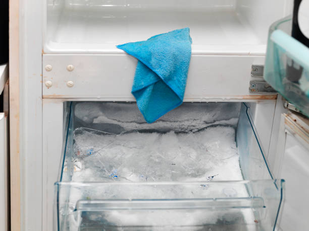 Closeup of fridge and freezer cleaning and defrosting, indoor closeup