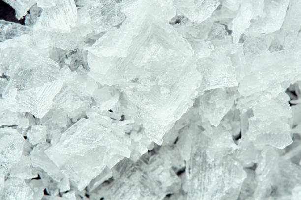 Sea salt crystals on a black background, super macro image. Wallpaper concept.